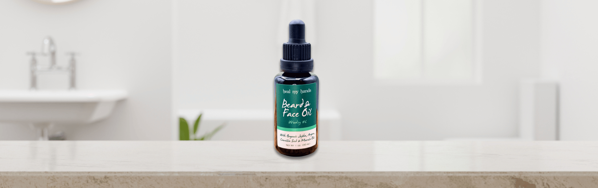 Bottle of facial oil on a bathroom counter with a blurred background