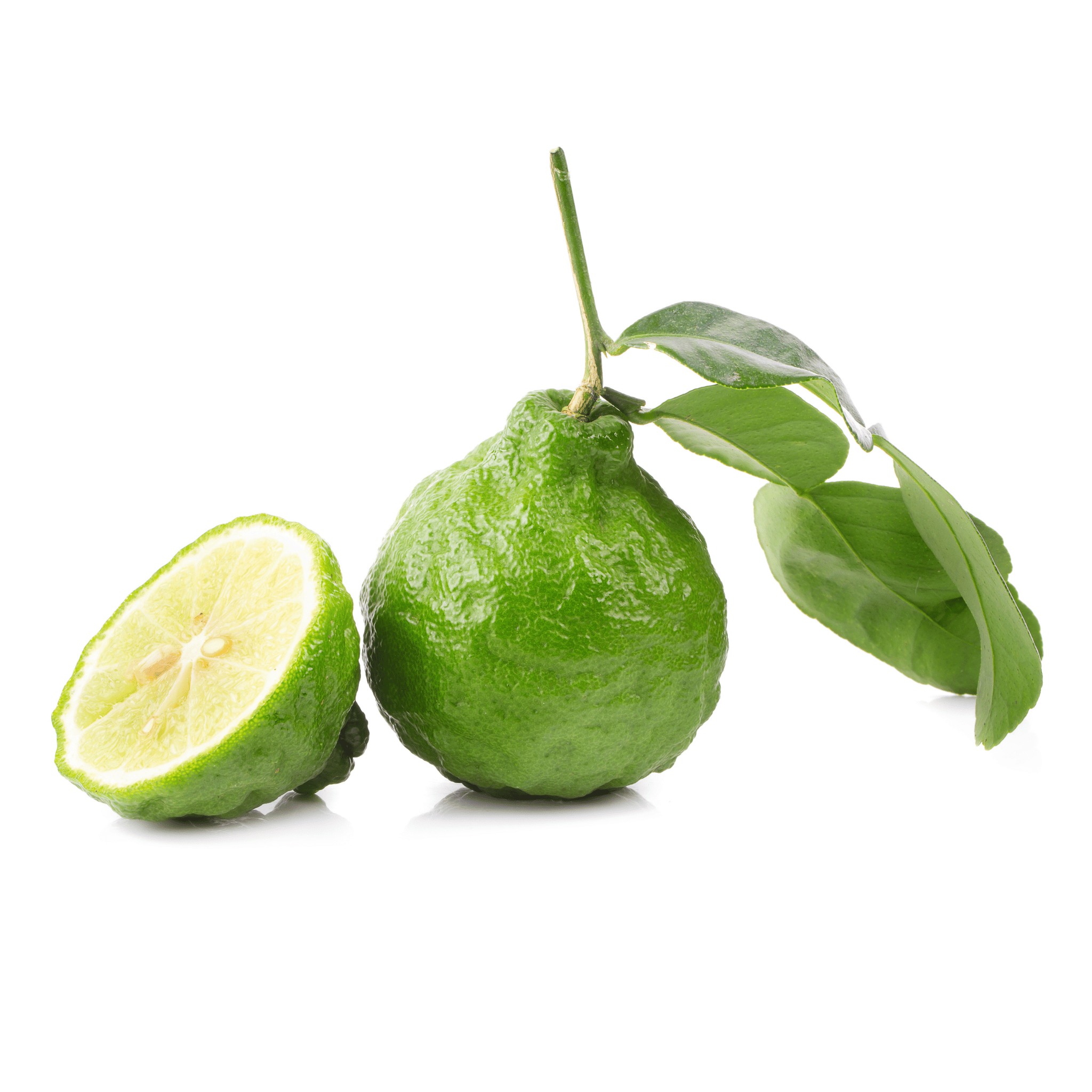 Green bergamot citrus fruit with a half-cut version on a white background