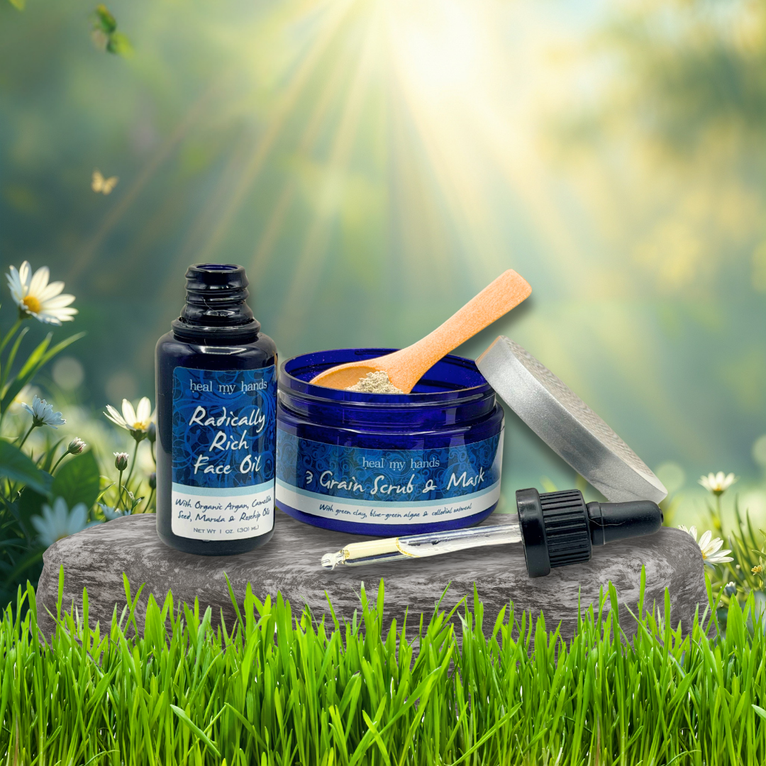 Radically Rich Face Oil and 3-Grain Scrub & Mask on a stone with a natural background