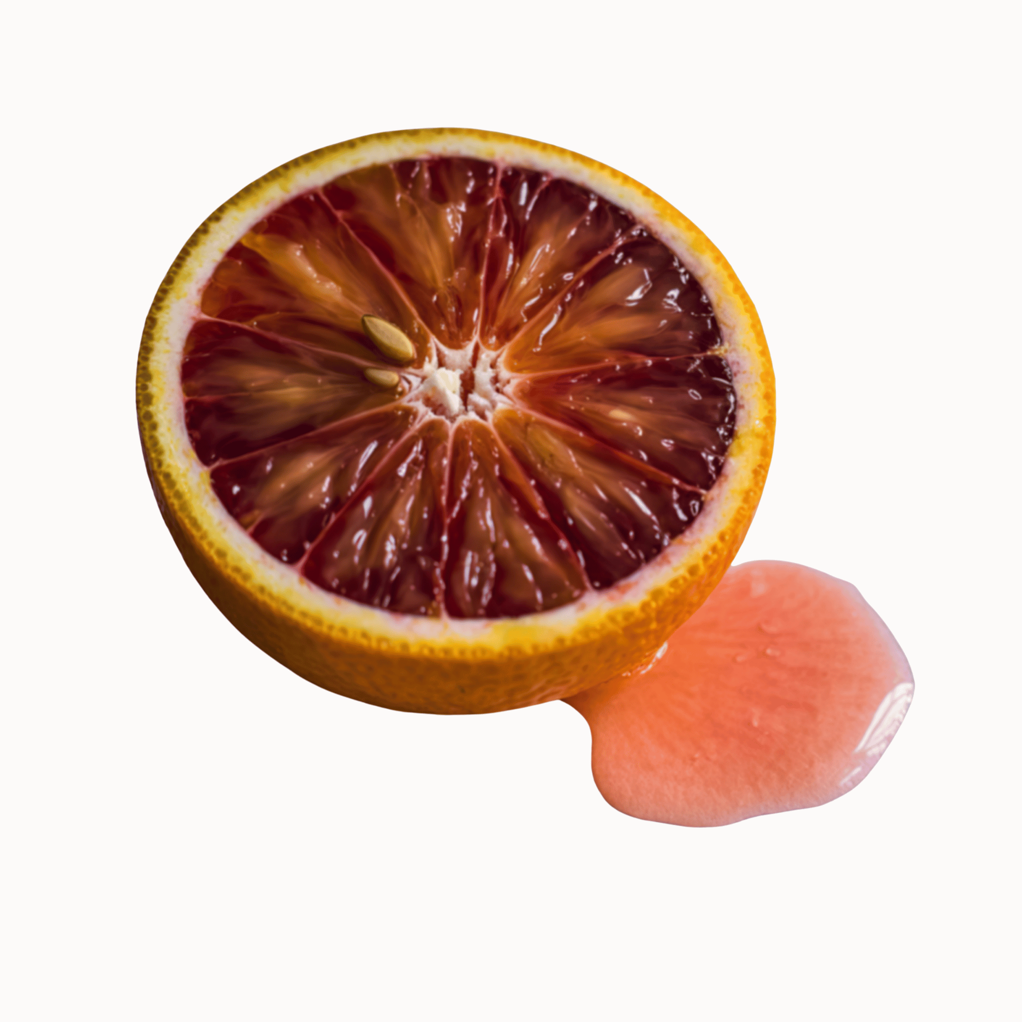 Half of a blood orange with orange juice on a white background
